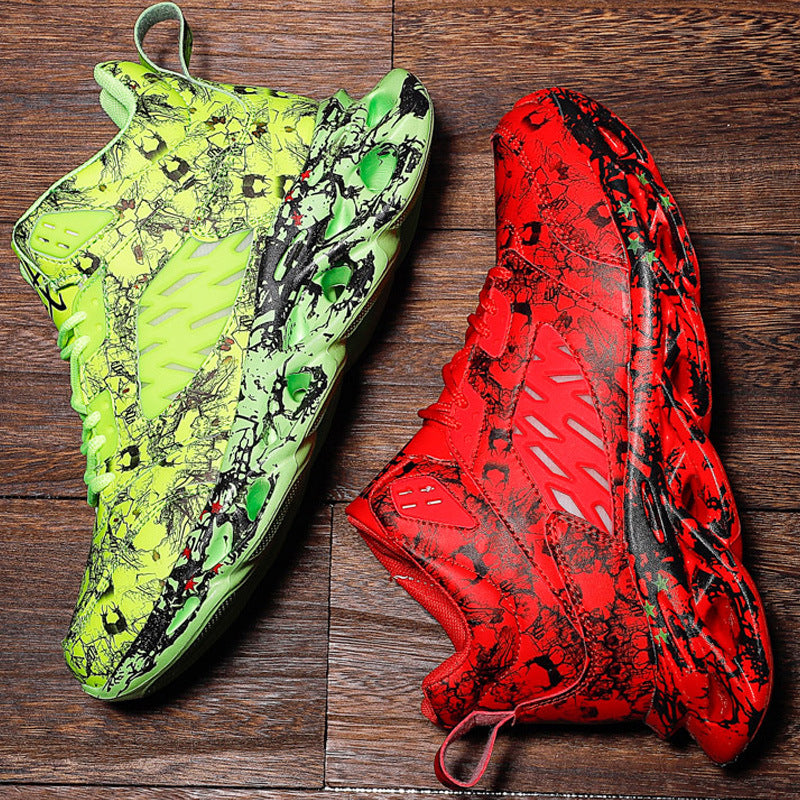 Two soccer cleats, one green and one red with black patterns, on a wooden surface.